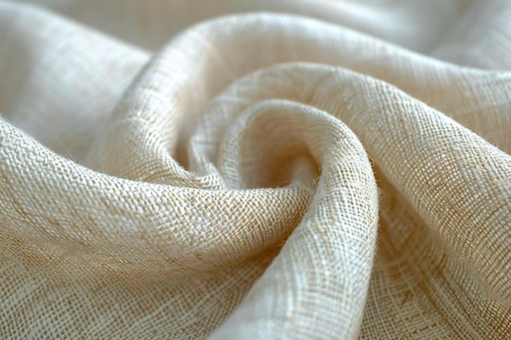 Close-up of linen fabric showing texture and weave, illustrating how linen stretches and behaves