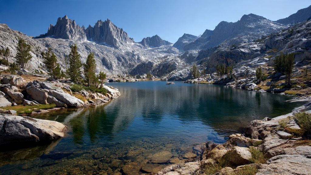 High-elevation alpine lake surrounded by granite peaks in Kings Canyon National Park Sierra Nevada golden trout habitat