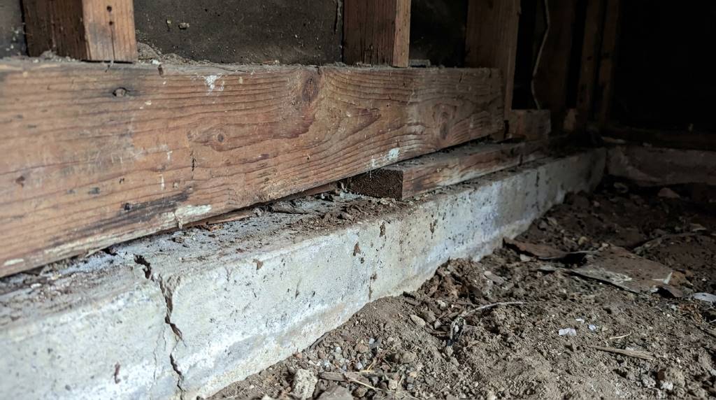 Structural contractor inspecting a shifting mud sill in San Jose
